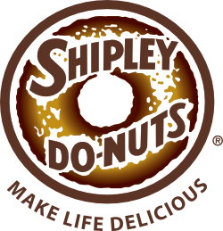 A box of assorted Shipleys Do-nuts featuring glazed, chocolate, and sprinkled varieties, showcasing their delicious selection