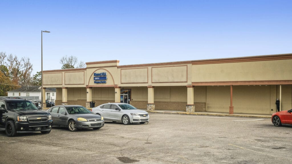 Two-story commercial building on Peach Orchard Rd, Augusta, GA, featuring a brick facade and large windows.