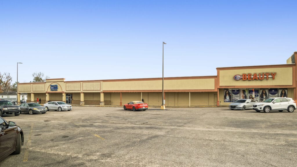 Two commercial buildings on Peach Orchard Rd in Augusta, GA, showcasing their architecture and surrounding landscape.