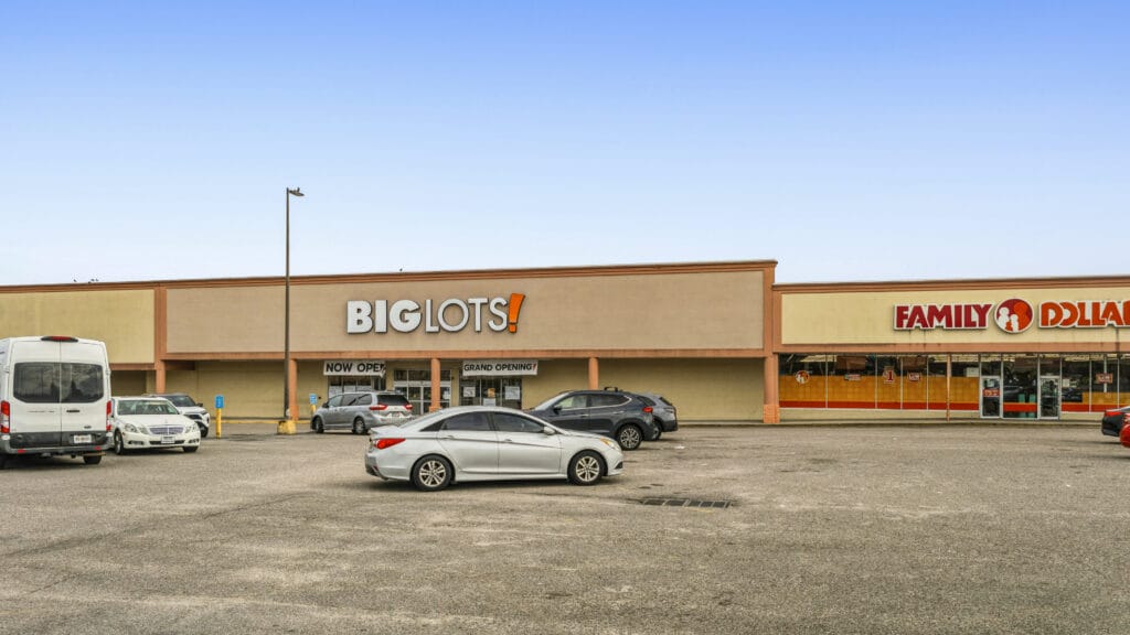 Two commercial buildings on Peach Orchard Rd, Augusta, GA, showcasing a brick exterior and ample parking space.