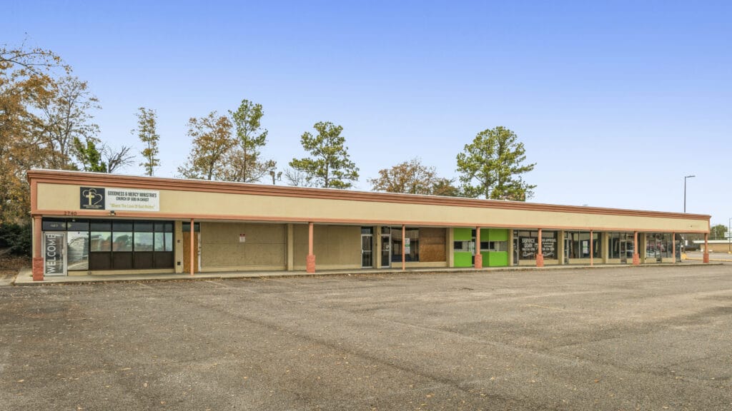 Two commercial buildings on Peach Orchard Rd in Augusta, GA, showcasing a modern design and ample parking.