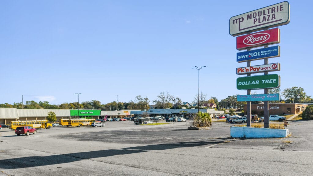 Exterior view of Moultrie Plaza, showcasing the building's architecture and surrounding landscape.