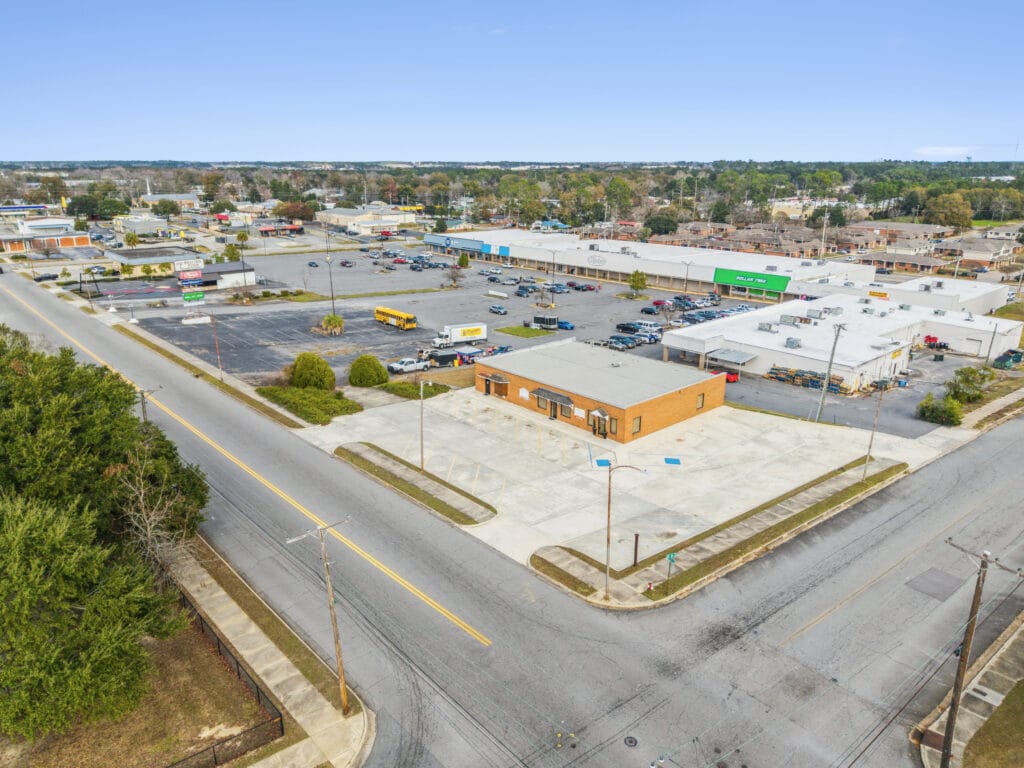 Exterior view of Moultrie Plaza, showcasing the building's architecture and surrounding landscape.