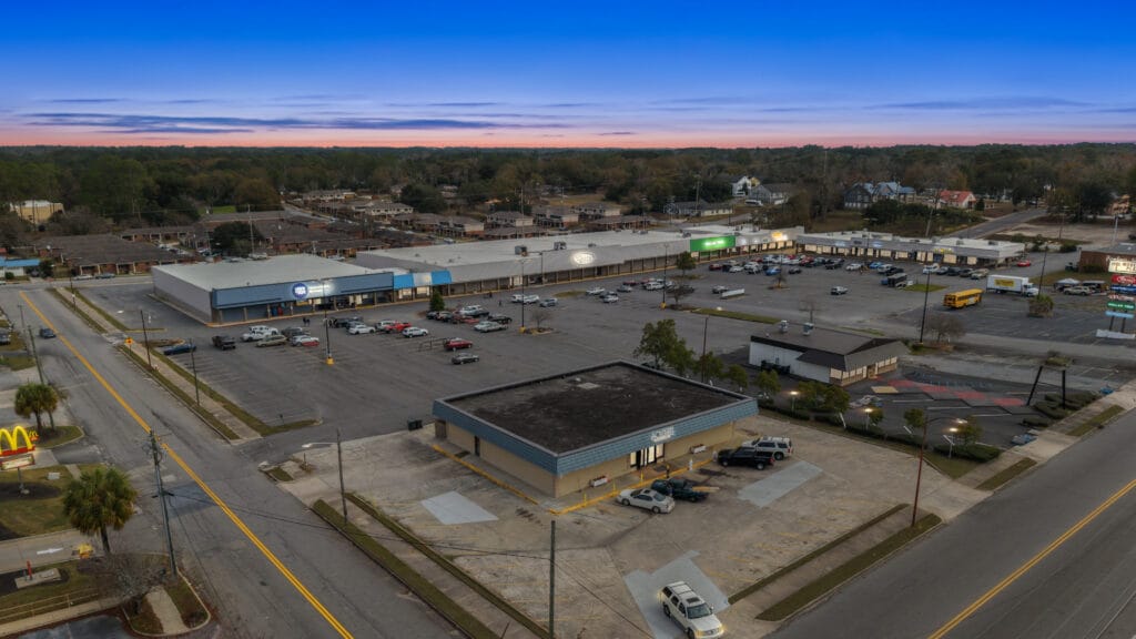 Exterior view of Moultrie Plaza, showcasing the building's architecture and surrounding landscaping.