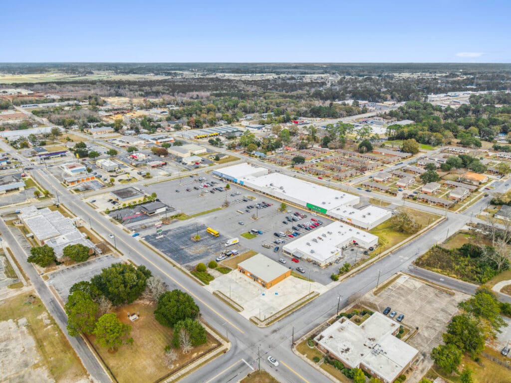 Exterior view of Moultrie Plaza, showcasing the building's architecture and surrounding landscape.