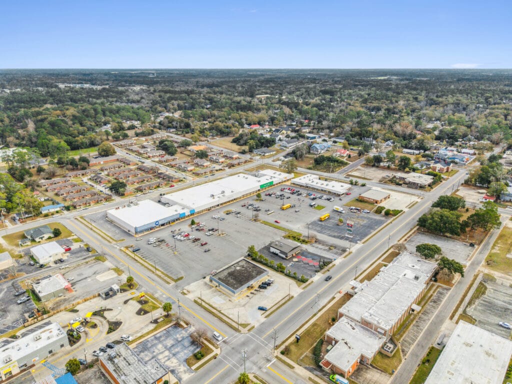 Exterior view of Moultrie Plaza at 215 5th St SE, showcasing the building's architecture and surrounding area.