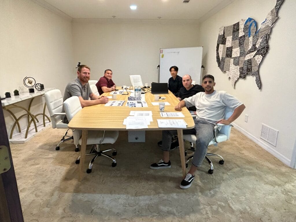 A conference room filled with diverse professionals engaged in a meeting, discussing strategies for the headquater meeting 12